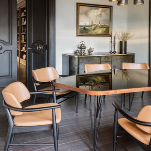 Traditional enclosed dining room in London with white walls, dark hardwood flooring and brown floors.