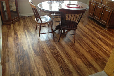 Large dark wood floor enclosed dining room photo in Birmingham with white walls and no fireplace