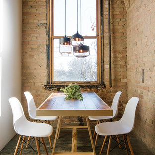 Inspiration for an industrial dark wood floor dining room remodel in Minneapolis