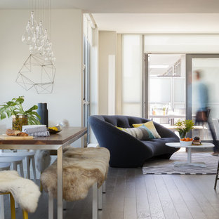 Example of a trendy dark wood floor great room design in San Francisco with white walls