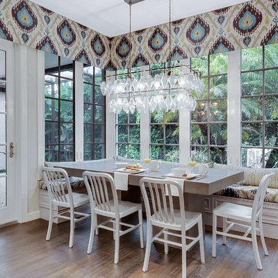 Kitchen/dining room combo - mid-sized transitional dark wood floor and brown floor kitchen/dining room combo idea in Miami with gray walls and no fireplace