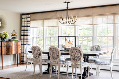Elegant medium tone wood floor and brown floor dining room photo in Portland Maine with gray walls