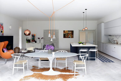 Design ideas for a large contemporary dining room in Dublin with white walls and light hardwood flooring.