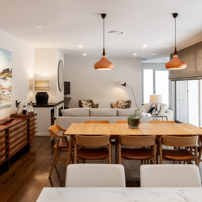 Mid-sized trendy medium tone wood floor and brown floor dining room photo in Melbourne with white walls