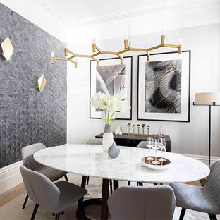 Photo of a contemporary dining room in London with grey walls, light hardwood flooring and no fireplace.