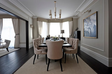Photo of a large traditional open plan dining room in London with beige walls and dark hardwood flooring.