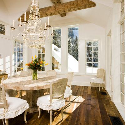 Inspiration for a mid-sized rustic dark wood floor and brown floor great room remodel in Denver with white walls and no fireplace