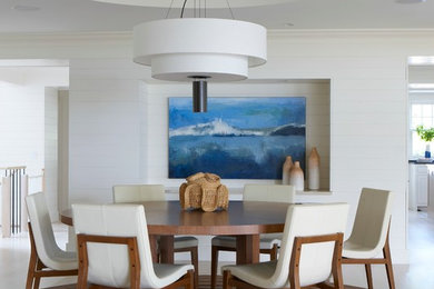 Mid-sized beach style light wood floor and beige floor dining room photo in Boston with white walls and no fireplace