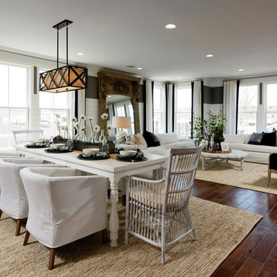 Great room - huge traditional brown floor and vinyl floor great room idea in DC Metro with multicolored walls, a ribbon fireplace and a wood fireplace surround