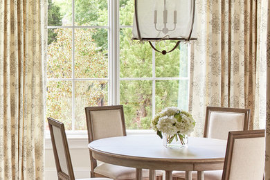 Elegant dining room photo in Charlotte with beige walls