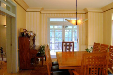 Small transitional enclosed dining room photo in Boston with yellow walls