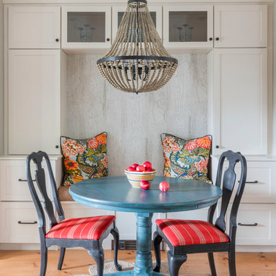Example of a small beach style light wood floor and beige floor dining room design in Boston