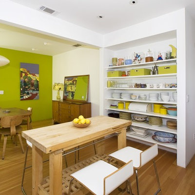 Dining room - contemporary medium tone wood floor dining room idea in San Francisco with green walls