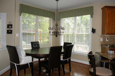 Photo of a small traditional kitchen/dining room in DC Metro with beige walls, medium hardwood flooring and no fireplace.