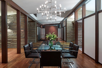 Example of a mid-sized trendy dark wood floor and brown floor kitchen/dining room combo design in Philadelphia with white walls