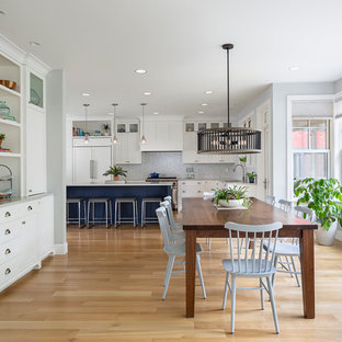 Inspiration for a large transitional light wood floor and beige floor kitchen/dining room combo remodel in Minneapolis with gray walls and no fireplace