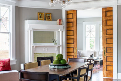 Inspiration for a transitional dark wood floor and brown floor dining room remodel in Atlanta with gray walls