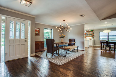 Great room - large transitional medium tone wood floor and brown floor great room idea in Dallas with gray walls and no fireplace