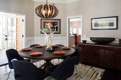 Enclosed dining room - mid-sized transitional dark wood floor enclosed dining room idea in Tampa with gray walls and no fireplace