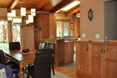 Example of an arts and crafts medium tone wood floor kitchen/dining room combo design in Minneapolis with beige walls