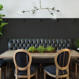 Dining room - transitional medium tone wood floor dining room idea in San Francisco with black walls