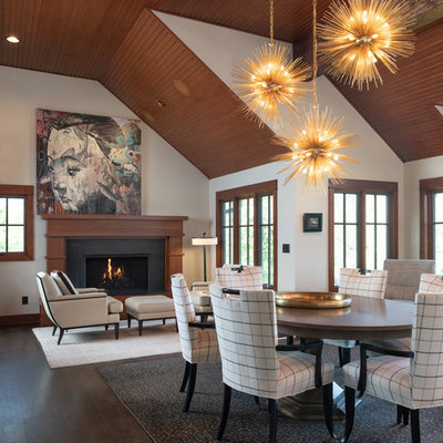 Mountain style dark wood floor and brown floor dining room photo in Kansas City with white walls and a standard fireplace