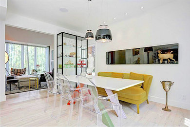 Inspiration for a contemporary light wood floor and beige floor great room remodel in Calgary with white walls and no fireplace