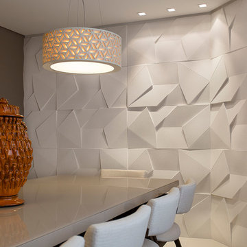 Modern dining room with white textured concrete wall panelling