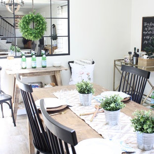 Idées déco pour une salle à manger ouverte sur la cuisine campagne de taille moyenne avec un mur blanc, un sol en vinyl, aucune cheminée et un sol marron.