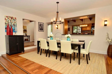 Kitchen/dining room combo - large transitional dark wood floor kitchen/dining room combo idea in Cleveland with white walls and no fireplace