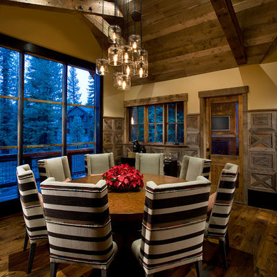 Large mountain style dark wood floor and brown floor dining room photo in Sacramento with beige walls