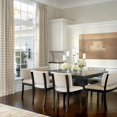 Example of a classic dark wood floor dining room design in Other with beige walls