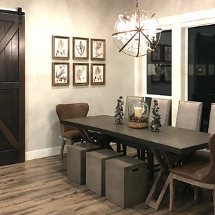 Immagine di una sala da pranzo country di medie dimensioni con pareti grigie, pavimento in gres porcellanato, nessun camino e pavimento grigio