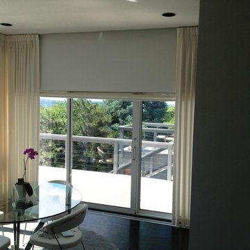 Motorized Roller Shades paired with soft treatments.
