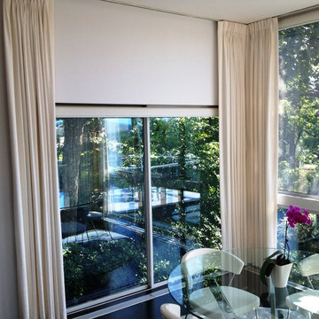 Motorized Roller Shades paired with soft treatments.