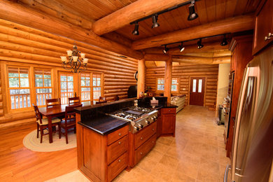 Large mountain style medium tone wood floor dining room photo in Phoenix with no fireplace and a tile fireplace