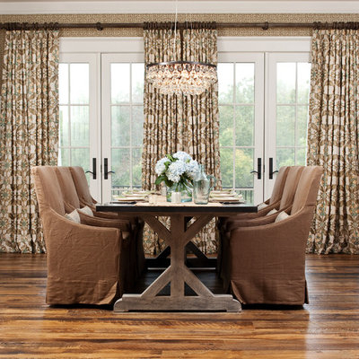 Example of a mid-sized mountain style medium tone wood floor dining room design in Richmond with beige walls and no fireplace
