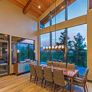 Inspiration for a modern light wood floor kitchen/dining room combo remodel in Denver with beige walls