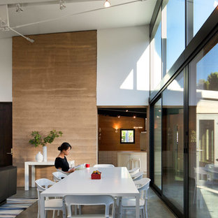 Inspiration for a mid-sized contemporary concrete floor great room remodel in San Francisco with no fireplace