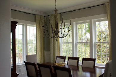 Example of a mid-sized transitional dark wood floor kitchen/dining room combo design in Charleston with gray walls and no fireplace