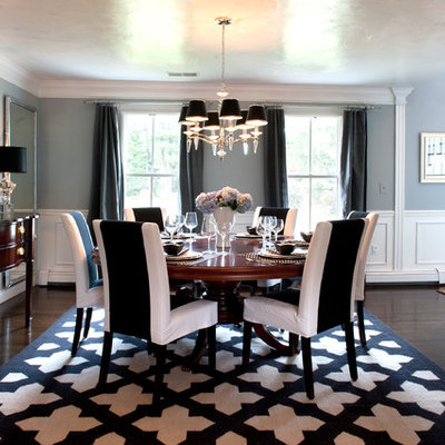Example of a classic dining room design in Boston with gray walls