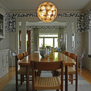 Arts and crafts medium tone wood floor dining room photo in Seattle with multicolored walls
