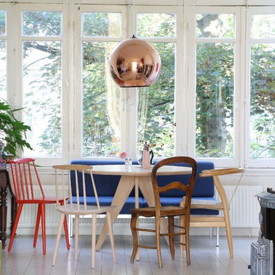 Danish dining room photo in Amsterdam with white walls