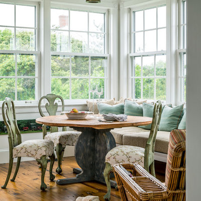 Inspiration for a coastal medium tone wood floor kitchen/dining room combo remodel in New York with white walls