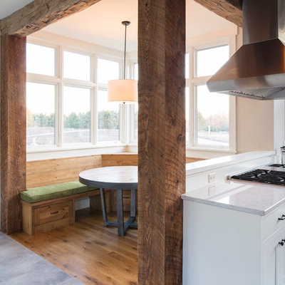 Kitchen/dining room combo - small cottage light wood floor kitchen/dining room combo idea in Minneapolis with beige walls and no fireplace