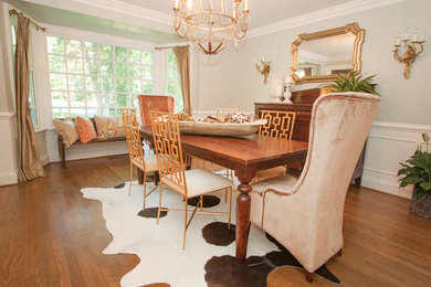 Example of a large eclectic medium tone wood floor enclosed dining room design in Richmond with gray walls and no fireplace