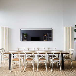 Photo of a contemporary open plan dining in Melbourne with white walls, no fireplace and beige floor.