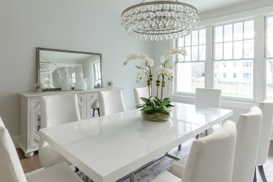 Inspiration for a mid-sized transitional carpeted and gray floor dining room remodel in New York with gray walls