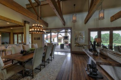 Example of a transitional medium tone wood floor great room design in Austin