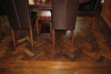 Example of a mid-sized cottage dark wood floor enclosed dining room design in Toronto